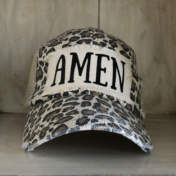Amen hat by BohoGroove with black Amen lettering on distressed off-white patch on a leopard vintage distressed snapback.