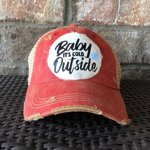 Baby It's Cold Outside hat by BohoGroove with black script lettering and a blue snowflake graphic on a distressed off-white custom patch on a red vintage distressed snapback.