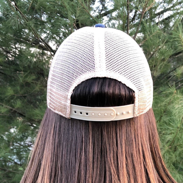 Back view of BohoGroove vintage distressed trucker hat with adjustable snapback closure and mesh back