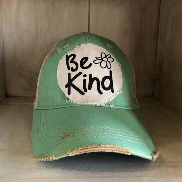 Be Kind hat by BohoGroove with black Be Kind lettering and flower graphic on distressed off-white patch on mint vintage distressed snapback.