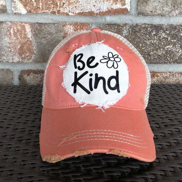 Be Kind hat by BohoGroove with black Be Kind lettering and flower graphic on distressed off-white patch on pink melon vintage distressed snapback.