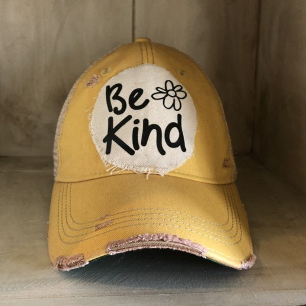 Be Kind hat by BohoGroove with black Be Kind lettering and flower graphic on distressed off-white patch on yellow vintage distressed snapback.