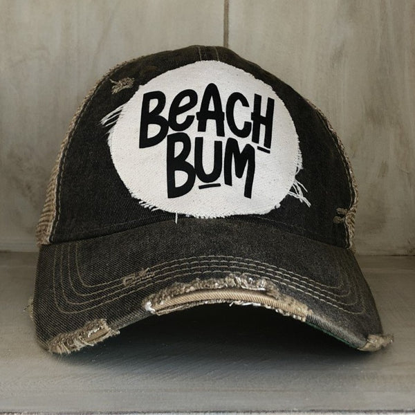 Beach Bum hat by BohoGroove featuring distressed off-white patch with black Beach Bum lettering on a black vintage distressed snapback