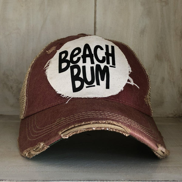 Beach Bum hat by BohoGroove featuring distressed off-white patch with black Beach Bum lettering on a brick red vintage distressed snapback