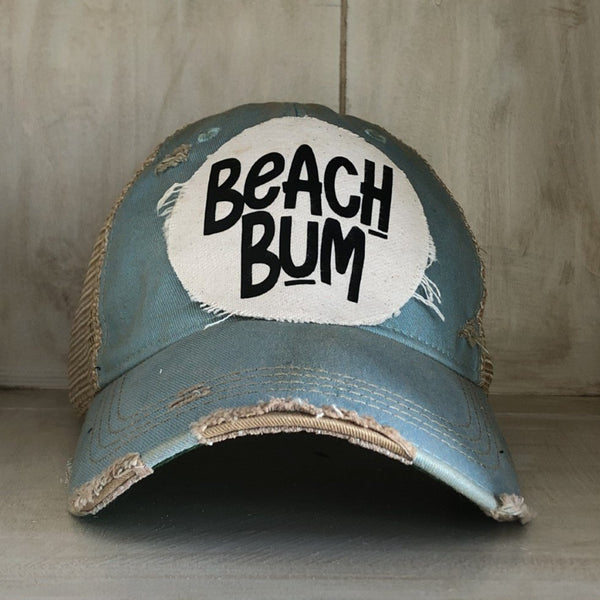 Beach Bum hat by BohoGroove with black Beach Bum lettering on distressed off-white patch on a ocean blue vintage distressed snapback.