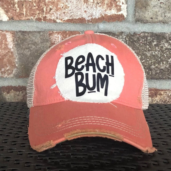 Beach Bum hat by BohoGroove featuring distressed off-white patch with black Beach Bum lettering on a pink melon vintage distressed snapback