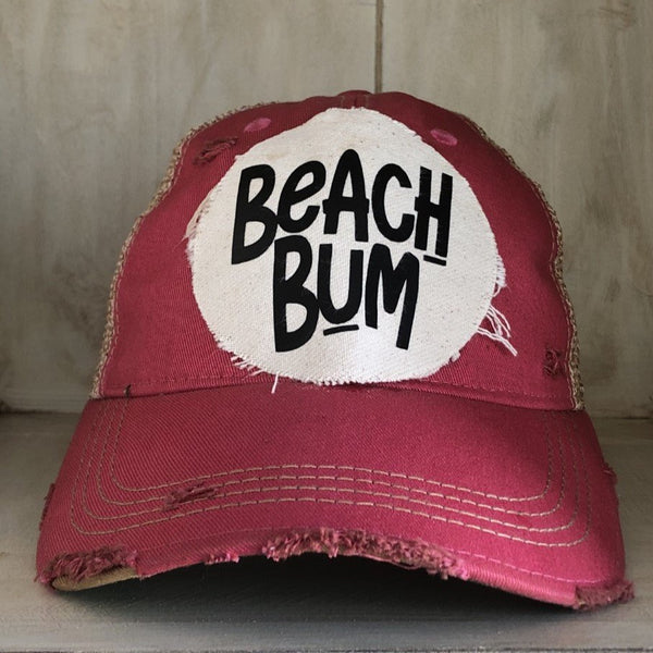 Beach Bum hat by BohoGroove with black Beach Bum lettering on distressed off-white patch on a pink vintage distressed snapback.