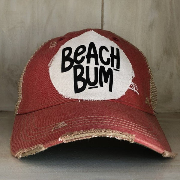 Beach Bum hat by BohoGroove with black Beach Bum lettering on distressed off-white patch on a red vintage distressed snapback.