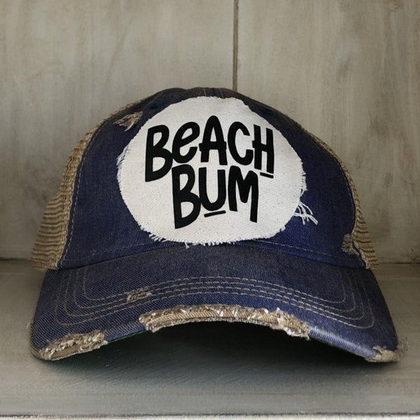 Beach Bum hat by BohoGroove with black Beach Bum lettering on distressed off-white patch on a royal blue vintage distressed snapback.