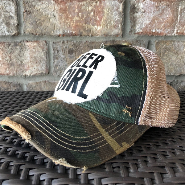 Right side view of a Beer Girl hat by BohoGroove with black Beer Girl lettering on a distressed off-white patch on a camo vintage distressed snapback trucker hat.