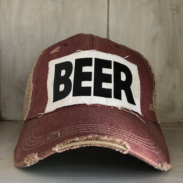 Beer hat by BohoGroove with black lettering on a distressed off-white custom patch on a brick red vintage distressed snapback.