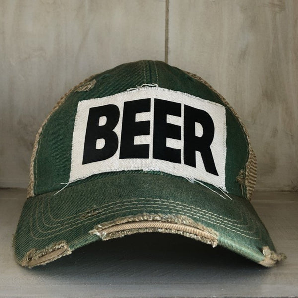 Beer hat by BohoGroove with black lettering on a distressed off-white custom patch on a green vintage distressed snapback.