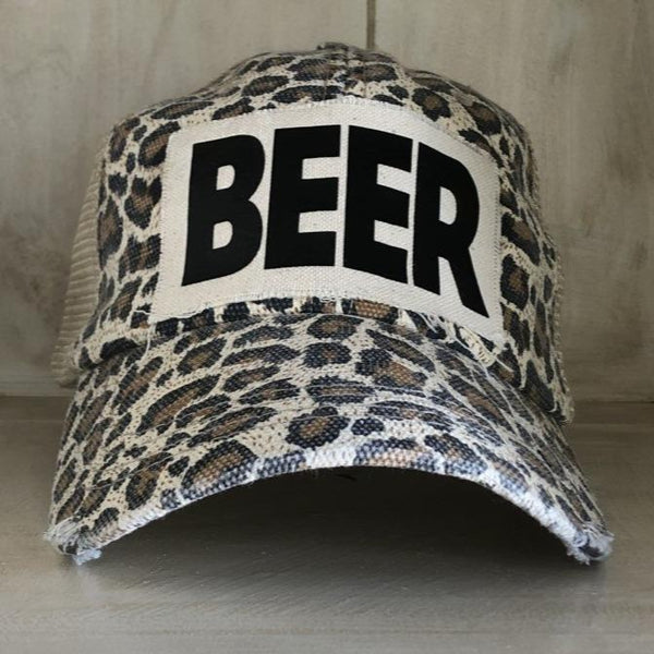 Beer hat by BohoGroove with black lettering on a distressed off-white custom patch on a leopard vintage distressed snapback.
