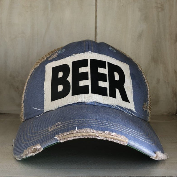 Beer hat by BohoGroove with black lettering on a distressed off-white custom patch on a light blue vintage distressed snapback.