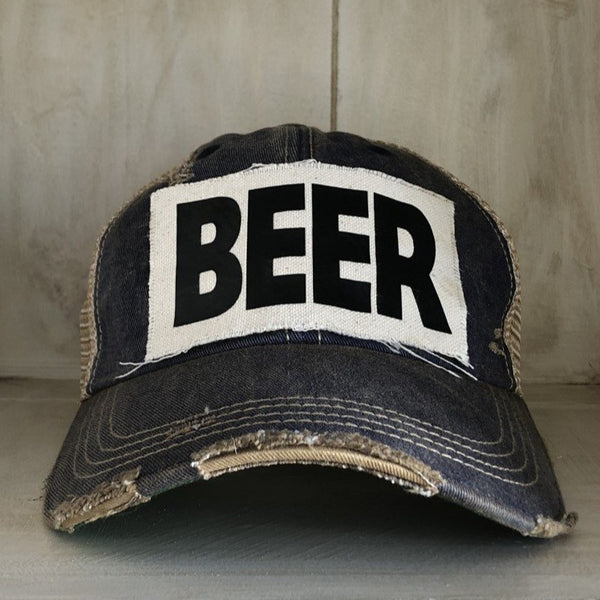 Beer hat by BohoGroove with black lettering on a distressed off-white custom patch on a navy blue vintage distressed snapback.