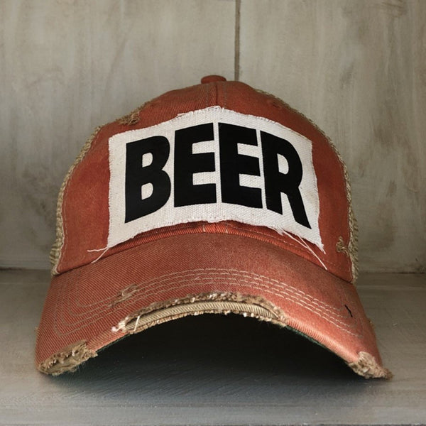 Beer hat by BohoGroove with black lettering on a distressed off-white custom patch on an orange vintage distressed snapback.