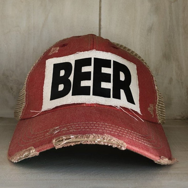 Beer hat by BohoGroove with black lettering on a distressed off-white custom patch on a red vintage distressed snapback.