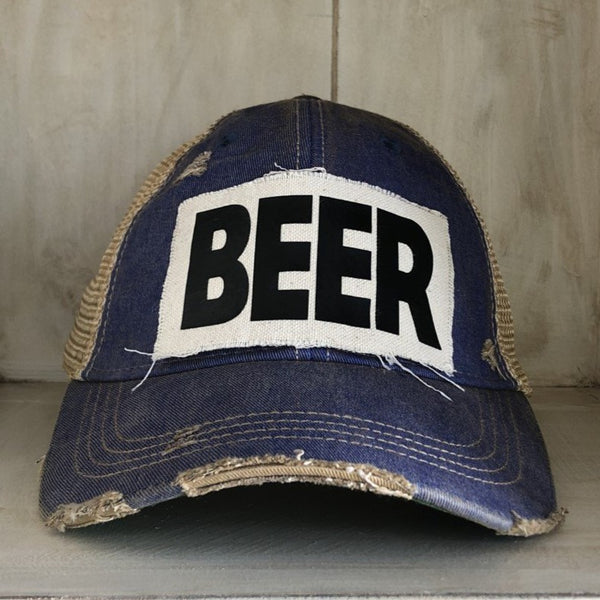 Beer hat by BohoGroove with black lettering on a distressed off-white custom patch on a royal blue vintage distressed snapback.