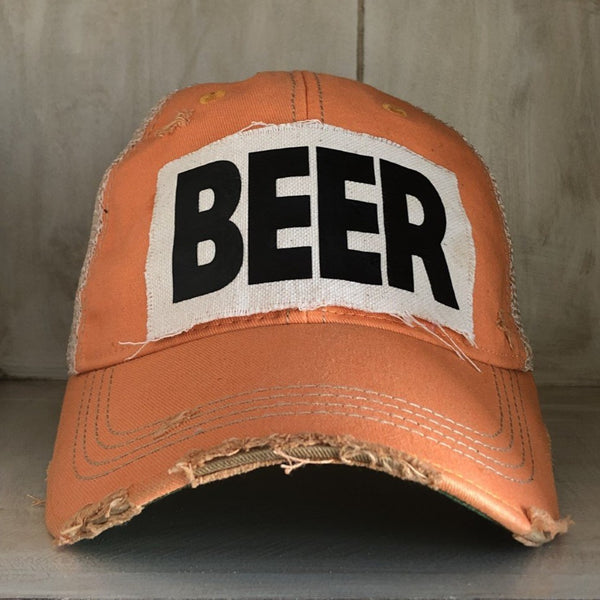 Beer hat by BohoGroove with black lettering on a distressed off-white custom patch on a sherbet vintage distressed snapback.