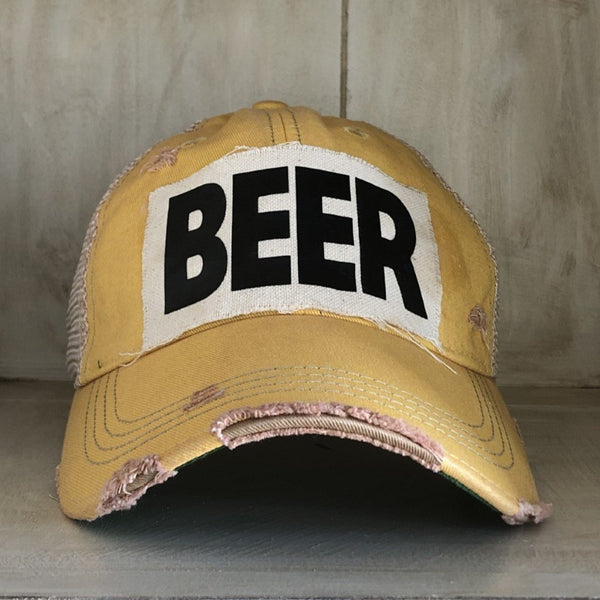 Beer hat by BohoGroove with black lettering on a distressed off-white custom patch on a yellow vintage distressed snapback.