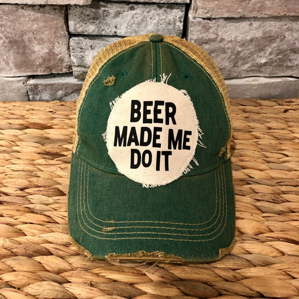 Beer Made Me Do It hat by BohoGroove featuring black Beer Made Me Do It lettering on a distressed off-white patch on a green vintage distressed snapback trucker hat.