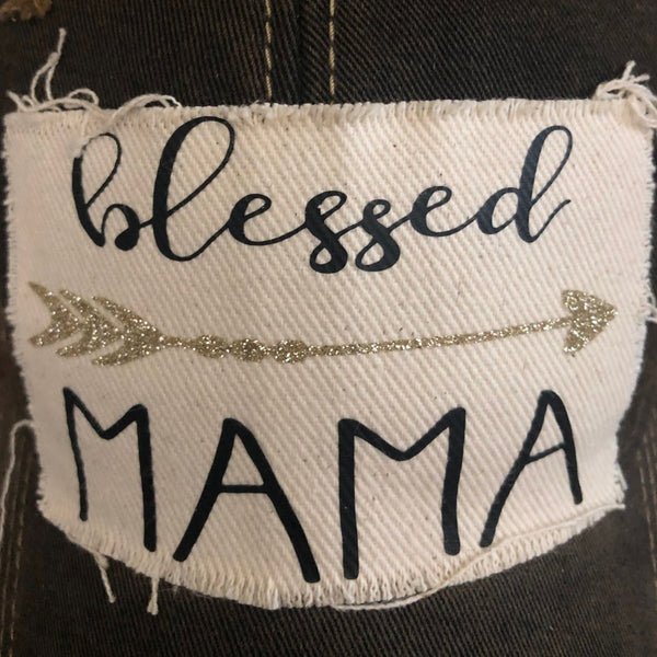 Blessed Mama hat by BohoGroove featuring black Blessed Mama lettering and arrow graphic on a black vintage distressed snapback hat close up view