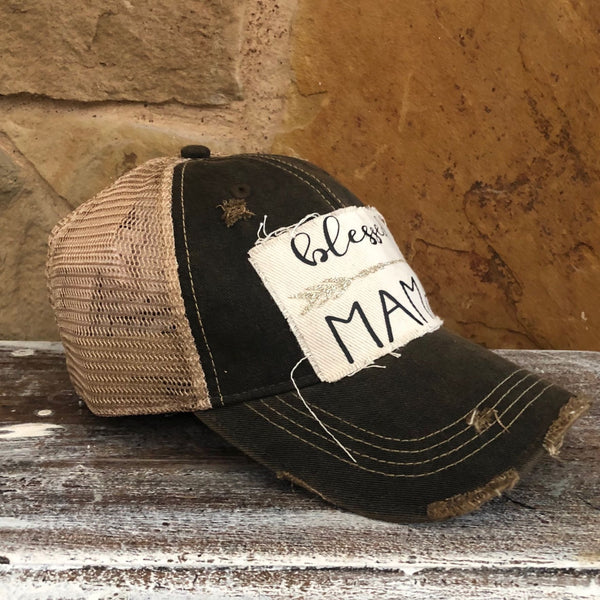 Blessed Mama hat by BohoGroove featuring black Blessed Mama lettering and arrow graphic on a black vintage distressed snapback hat right side 