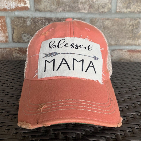Blessed Mama hat by BohoGroove featuring black Blessed Mama lettering and arrow graphic on a sherbet vintage distressed snapback hat
