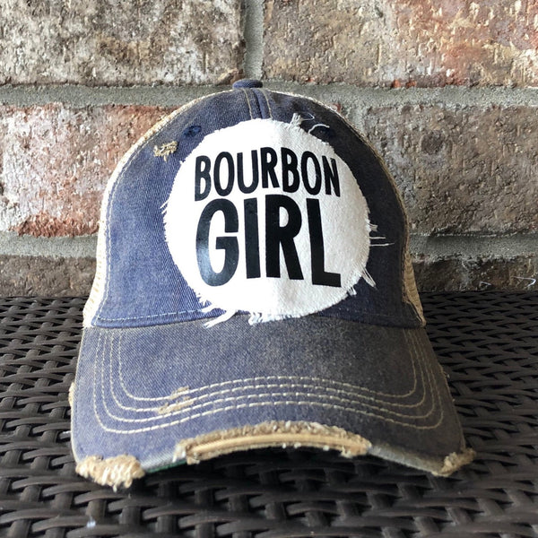 Bourbon Girl hat by BohoGroove with black lettering on a distressed off-white patch on a navy blue vintage distressed snapback.