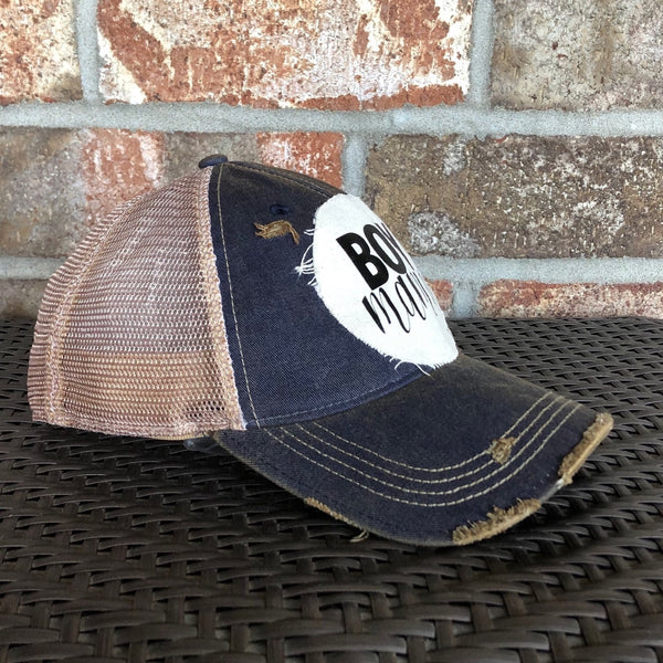 Boy Mama Hat by BohoGroove with black Boy Mama lettering and heart graphic on distressed off-white patch on a navy blue vintage distressed snapback left side 