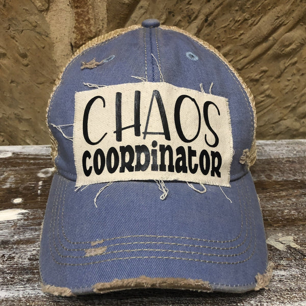Chaos Coordinator hat by BohoGroove with black Chaos Coordinator lettering on a distressed off-white patch on a light blue vintage distressed snapback trucker hat.
