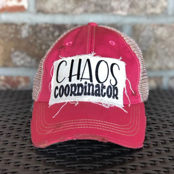 Chaos Coordinator hat by BohoGroove with black Chaos Coordinator lettering on a distressed off-white patch on a pink vintage distressed snapback trucker hat.