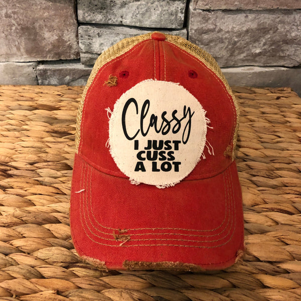 Classy, I Just Cuss a Lot hat by BohoGroove with black lettering on a distressed off-white patch on a red vintage distressed snapback trucker hat.