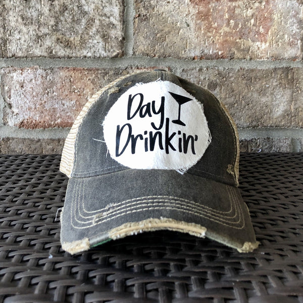 Day Drinkin hat by BohoGroove with black Day Drinkin lettering and martini glass graphic on distressed off-white patch on a black vintage distressed snapback.