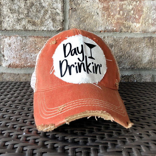 Day Drinkin hat by BohoGroove with black Day Drinkin lettering and martini glass graphic on distressed off-white patch on an orange vintage distressed snapback.