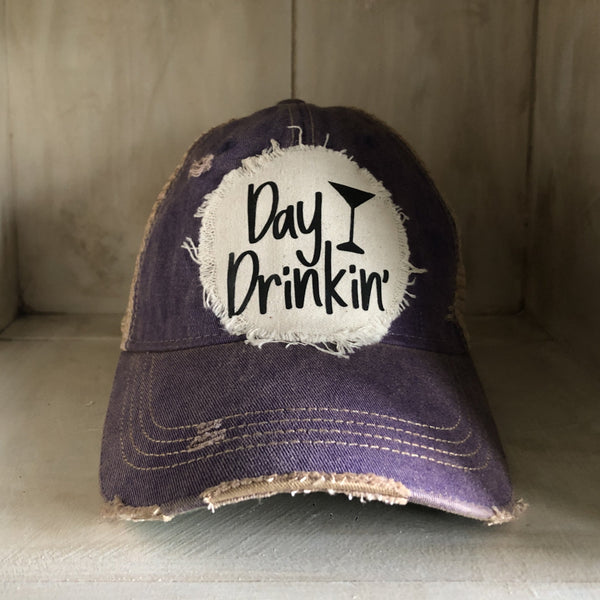 Day Drinkin hat by BohoGroove with black Day Drinkin lettering and martini glass graphic on distressed off-white patch on a purple vintage distressed snapback.