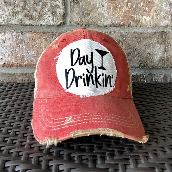 Day Drinkin hat by BohoGroove with black Day Drinkin lettering and martini glass graphic on distressed off-white patch on a red vintage distressed snapback.