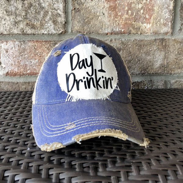 Day Drinkin hat by BohoGroove with black Day Drinkin lettering and martini glass graphic on distressed off-white patch on a royal blue vintage distressed snapback.