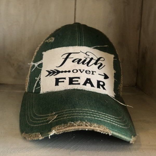Faith Over Fear hat by BohoGroove with black Faith Over Fear lettering and arrow graphic on distressed off-white patch on green vintage distressed snapback.
