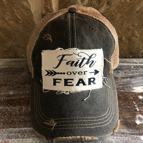 Faith Over Fear hat by BohoGroove with black Faith Over Fear lettering and arrow graphic on distressed off-white patch on navy vintage distressed snapback.