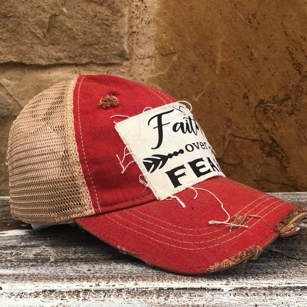 Faith Over Fear hat by BohoGroove with black Faith Over Fear lettering and arrow graphic on distressed off-white patch on red vintage distressed snapback left side.