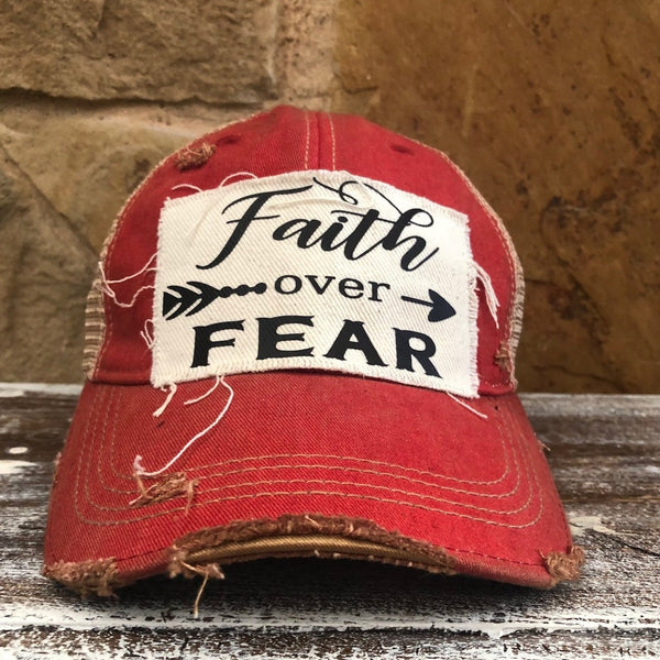Faith Over Fear hat by BohoGroove with black Faith Over Fear lettering and arrow graphic on distressed off-white patch on red vintage distressed snapback.