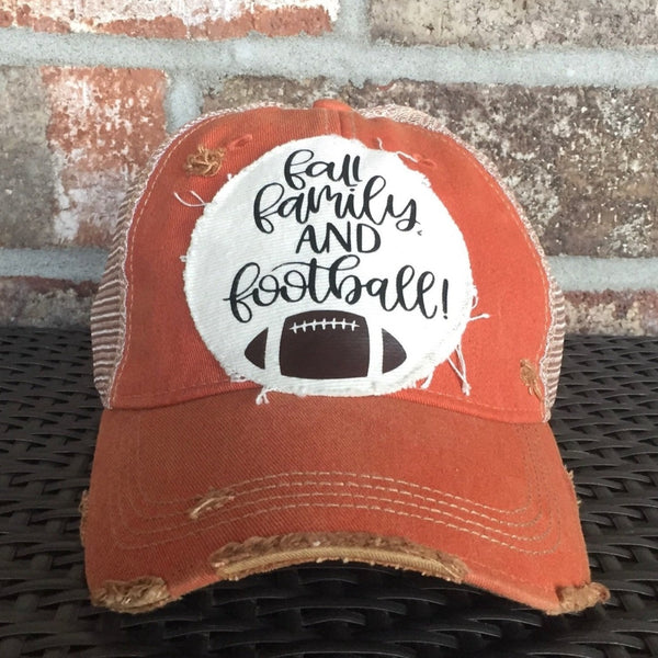 Fall Family and Football hat by BohoGroove with black Fall Family and Football lettering and football graphic on a cream patch on an orange vintage distressed snapback.
