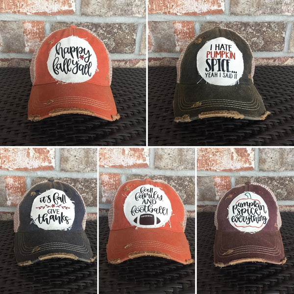 Collage of five fall-themed hats by BohoGroove featuring Happy Fall Y’all, I Hate Pumpkin Spice Yeah I Said It, It's Fall Give Thanks, Fall Family and Football, and Pumpkin Spice Is Everything designs on vintage distressed snapback hats.