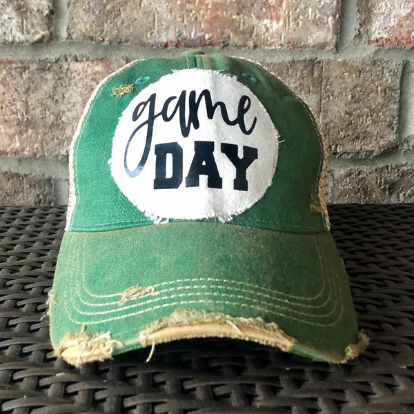 Game Day sports hat by BohoGroove with black Game Day lettering on distressed off-white patch on green vintage distressed snapback.