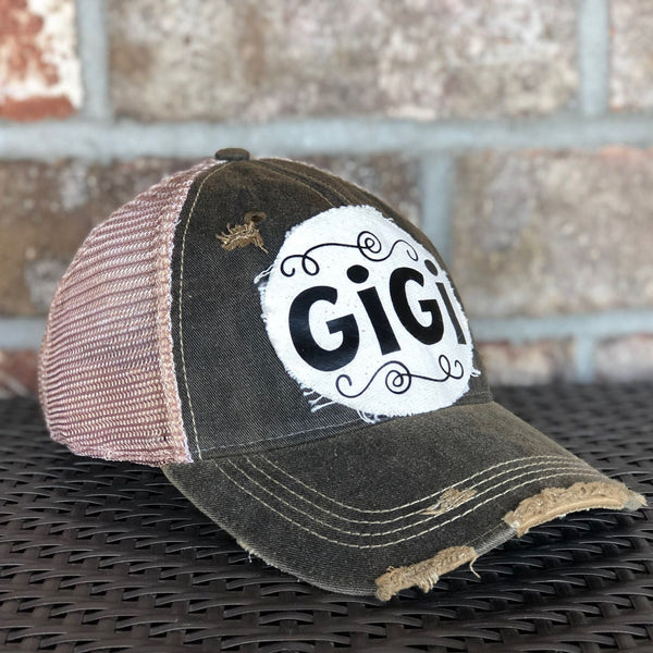 Gigi Hat by BohoGroove with black Gigi lettering on distressed off-white patch on a black vintage distressed snapback left side 