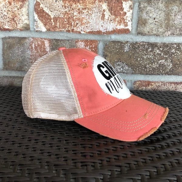 Girl Mama hat by BohoGroove with black Girl Mama lettering and heart graphic on distressed off-white patch on a pink melon vintage distressed snapback left side