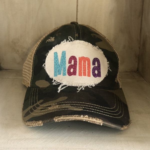 Mama Hat by BohoGroove with turquoise, pink, orange, and purple glitter Mama lettering on distressed off-white patch on a camo vintage distressed snapback