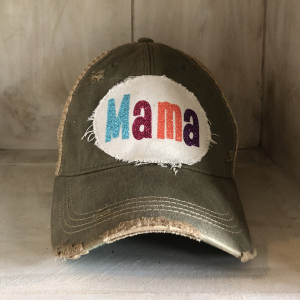 Mama Hat by BohoGroove with turquoise, pink, orange, and purple glitter Mama lettering on distressed off-white patch on an olive vintage distressed snapback