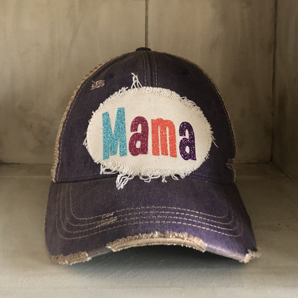 Mama Hat by BohoGroove with turquoise, pink, orange, and purple glitter Mama lettering on distressed off-white patch on a purple vintage distressed snapback